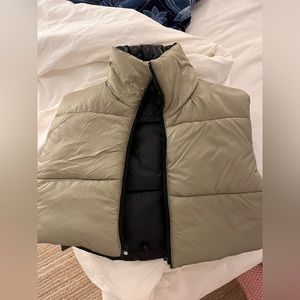 Reversible cropped puffer vest.